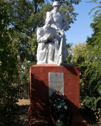 сел. Урожайне. Братська могила і пам'ятний знак загиблим землякам.